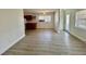 Open-concept living room with modern floors, ample natural light, and convenient access to the kitchen and other areas at 3211 S Ferdinand Ave, Tampa, FL 33629