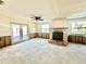 Living room with fireplace and sliding glass doors at 339 Country Club Dr, Oldsmar, FL 34677