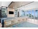 Modern bar with blue quartz countertop and barstools at 3401 Bayshore Blvd # 1904, Tampa, FL 33629