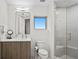 Clean and modern bathroom with a single vanity, toilet and a walk-in shower at 3401 Bayshore Blvd # 1904, Tampa, FL 33629