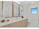 Modern bathroom with a light and airy feel, featuring a double vanity and a walk-in shower at 3401 Bayshore Blvd # 1904, Tampa, FL 33629