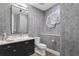 Modern powder room with dark vanity and unique wall paper at 3401 Bayshore Blvd # 1904, Tampa, FL 33629