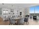 Elegant dining area features a glass-top table and gray velvet chairs at 3401 Bayshore Blvd # 1904, Tampa, FL 33629