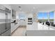 Modern kitchen with white cabinets, stainless steel appliances and expansive views at 3401 Bayshore Blvd # 1904, Tampa, FL 33629