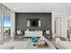 Spacious living room features a large TV and comfortable seating with city views at 3401 Bayshore Blvd # 1904, Tampa, FL 33629