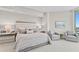 Spacious main bedroom with king-size bed and two comfy armchairs at 3401 Bayshore Blvd # 1904, Tampa, FL 33629