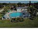 Community pool with surrounding patio and umbrellas at 3969 106Th N Ave, Clearwater, FL 33762