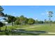 Scenic golf course view with lush green fairways and a tranquil lake at 3969 106Th N Ave, Clearwater, FL 33762