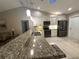 Modern kitchen featuring granite countertops and stainless steel appliances at 3969 106Th N Ave, Clearwater, FL 33762