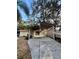 Covered carport with lattice sides, providing shade and parking at 405 Tennessee Ave, Crystal Beach, FL 34681