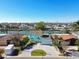 Aerial view of a waterfront home with a paved driveway at 545 Lillian Dr, Madeira Beach, FL 33708