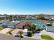Aerial view of waterfront home with paved driveway and canal access at 545 Lillian Dr, Madeira Beach, FL 33708