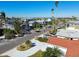 Aerial view of a home with a circular driveway and tropical landscaping at 545 Lillian Dr, Madeira Beach, FL 33708