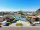 Aerial view of a waterfront home with a paved driveway at 545 Lillian Dr, Madeira Beach, FL 33708