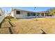 Backyard with grassy area and canal views at 545 Lillian Dr, Madeira Beach, FL 33708