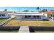 Home with screened-in porch and private dock perfect for relaxing at 545 Lillian Dr, Madeira Beach, FL 33708