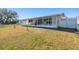 Home's backyard with canal view and fence at 545 Lillian Dr, Madeira Beach, FL 33708