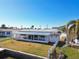 Home with screened-in porch overlooking a canal and private dock at 545 Lillian Dr, Madeira Beach, FL 33708
