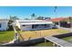 Home with screened-in porch, private dock, and canal views at 545 Lillian Dr, Madeira Beach, FL 33708