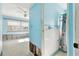 Bathroom with shower, toilet, and vintage tile, needing updates at 545 Lillian Dr, Madeira Beach, FL 33708