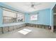 A bedroom needing renovation, featuring light blue walls and water damage at 545 Lillian Dr, Madeira Beach, FL 33708