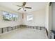 A bedroom needing renovation with water damage and a ceiling fan at 545 Lillian Dr, Madeira Beach, FL 33708
