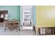 A simple dining area with a table and chairs, undergoing renovations at 545 Lillian Dr, Madeira Beach, FL 33708