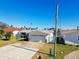 Single-story home with attached garage and spacious driveway at 545 Lillian Dr, Madeira Beach, FL 33708