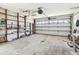Spacious garage, ideal for storage, with built-in shelving units at 545 Lillian Dr, Madeira Beach, FL 33708