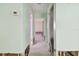 A light green hallway showing water damage and needing renovation at 545 Lillian Dr, Madeira Beach, FL 33708