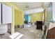 Open concept kitchen and dining area needing complete renovation at 545 Lillian Dr, Madeira Beach, FL 33708
