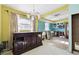 Kitchen area with dark wood cabinetry and yellow walls, needs renovation at 545 Lillian Dr, Madeira Beach, FL 33708