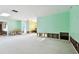 Large living room with light green walls, undergoing renovation at 545 Lillian Dr, Madeira Beach, FL 33708