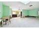 Living room with yellow and light green walls, ready for renovation at 545 Lillian Dr, Madeira Beach, FL 33708