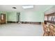 Renovation project in a spacious living room with light green walls at 545 Lillian Dr, Madeira Beach, FL 33708