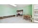 Living room with light green walls and a view, being remodeled at 545 Lillian Dr, Madeira Beach, FL 33708