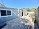 Small, paved backyard with partial view of home exterior at 5626 28Th S Ave, Gulfport, FL 33707