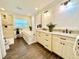Elegant bathroom with granite countertops, a soaking tub, and walk-in shower at 5626 28Th S Ave, Gulfport, FL 33707