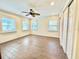 Bright bedroom with tile flooring, ceiling fan, and ample closet space at 5626 28Th S Ave, Gulfport, FL 33707