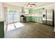 Modern kitchen with stainless steel appliances and green cabinets at 5626 28Th S Ave, Gulfport, FL 33707