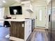 Modern kitchen with white cabinets, stainless steel appliances and light green door at 5626 28Th S Ave, Gulfport, FL 33707