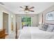 Main bedroom with sliding glass doors to the patio and en-suite bathroom at 605 Greenbriar Dr, Brandon, FL 33511