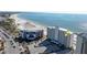 Aerial view of beachfront condo building with ocean and beach views at 7000 Beach Plz # 708, St Pete Beach, FL 33706