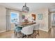 Bright dining area with ocean view and wooden table at 7000 Beach Plz # 708, St Pete Beach, FL 33706