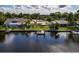 Waterfront property with dock and lush landscaping at 8800 Sunlit Cove Ne Dr, St Petersburg, FL 33702