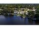 Aerial view of waterfront home and neighborhood at 8800 Sunlit Cove Ne Dr, St Petersburg, FL 33702