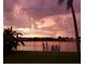 Scenic sunset view over calm water and dock at 8800 Sunlit Cove Ne Dr, St Petersburg, FL 33702