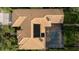 Bird's eye view of single Gathering home with pool and solar panels at 9901 Tree Tops Lake Rd, Tampa, FL 33626