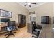 Bright home office with two desks and hardwood floors at 9901 Tree Tops Lake Rd, Tampa, FL 33626