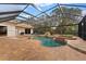 Screened pool and spa with waterfall feature at 9901 Tree Tops Lake Rd, Tampa, FL 33626